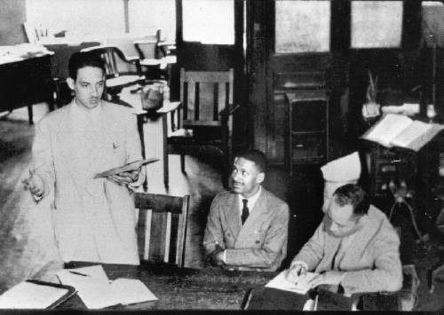 Thurgood Marshall stands in a Baltimore courtroom with his client, Donald Gaines Murray